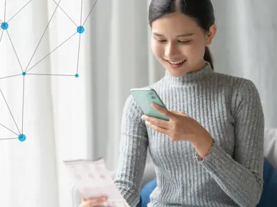 A young woman scanning a document with her mobile phone